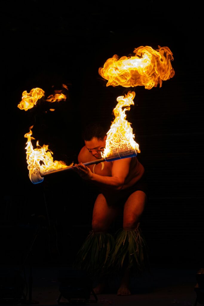 Stunning fire dance performance captured at night in Hawaii, showcasing cultural artistry.